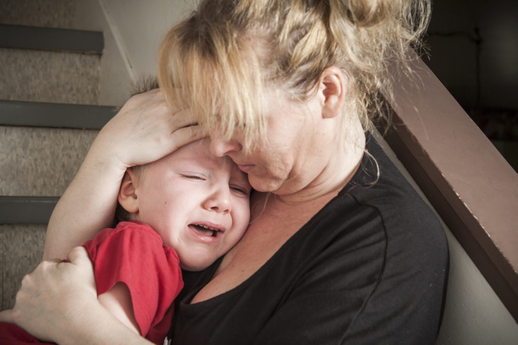 Homeless mother with crying child