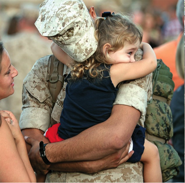 American soldier with young daughter