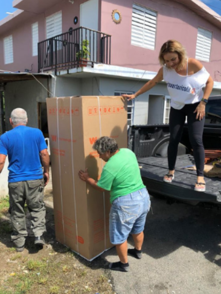 A disaster victim receives new appliances through the DCM program.